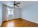 Bedroom featuring wood floors, a ceiling fan, and natural light at 8309 Windrush Ave, Las Vegas, NV 89117
