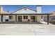 The rear exterior of the home has a patio, and hardscape at 8309 Windrush Ave, Las Vegas, NV 89117