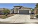 Charming single-story home with a tile roof, landscaped front yard, and two car garage at 8309 Windrush Ave, Las Vegas, NV 89117