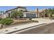 Lovely one-story home with desert landscaping, two car garage, and beautiful curb appeal at 8309 Windrush Ave, Las Vegas, NV 89117