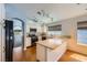 Bright kitchen featuring white cabinetry, stainless steel appliances, and a breakfast bar at 8309 Windrush Ave, Las Vegas, NV 89117