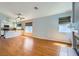 Open-concept living space with a fireplace and kitchen view at 8309 Windrush Ave, Las Vegas, NV 89117