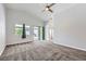 Large primary bedroom with vaulted ceiling and sliding glass doors to backyard patio at 8309 Windrush Ave, Las Vegas, NV 89117