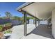 Covered patio, hardscape, and planting bed at 8309 Windrush Ave, Las Vegas, NV 89117