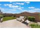 Inviting backyard featuring a cozy outdoor seating area with pavers and a fire pit at 8351 Vinamala Ave, Las Vegas, NV 89149