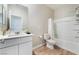 Neutral bathroom design featuring a vanity sink and a bathtub with a shower at 8351 Vinamala Ave, Las Vegas, NV 89149