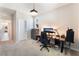 Bedroom with carpet, large cabinet, and a desk with decorative table lamp at 8351 Vinamala Ave, Las Vegas, NV 89149