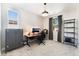 Study bedroom featuring natural light, gray bookcase, and a gray cabinet at 8351 Vinamala Ave, Las Vegas, NV 89149
