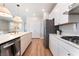 Open kitchen with stainless steel appliances and plenty of counter space for cooking at 8351 Vinamala Ave, Las Vegas, NV 89149