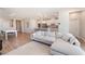 Spacious living area with an open floorplan, recessed lights, dining area and modern kitchen at 8351 Vinamala Ave, Las Vegas, NV 89149