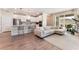 Open-concept living room with a large sectional sofa, open kitchen and sliding glass doors to patio at 8351 Vinamala Ave, Las Vegas, NV 89149