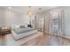 A spacious bedroom with a large bed, area rug, and a modern light fixture at 8351 Vinamala Ave, Las Vegas, NV 89149