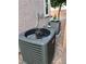 Goodman AC Unit on side of house with landscaping stones, stucco walls, and a small window at 8616 Willow Cabin St, Las Vegas, NV 89131