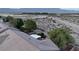 An aerial view of the backyard reveals a covered patio, mature trees, and privacy walls at 8616 Willow Cabin St, Las Vegas, NV 89131