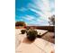 Backyard features a patio and landscaped areas; mountains in the distance at 8616 Willow Cabin St, Las Vegas, NV 89131