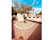 Inviting backyard with desert landscaping, mature trees, and a well-maintained patio area at 8616 Willow Cabin St, Las Vegas, NV 89131