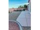 Outdoor patio with desert landscaping, gravel bed and concrete pavers at 8616 Willow Cabin St, Las Vegas, NV 89131