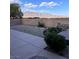Outdoor patio space with desert landscaping and scenic mountain views at 8616 Willow Cabin St, Las Vegas, NV 89131