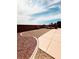 Spacious backyard with gravel landscaping, concrete patio, and privacy wall at 8616 Willow Cabin St, Las Vegas, NV 89131