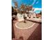 Landscaped backyard with mature trees and gravel accents at 8616 Willow Cabin St, Las Vegas, NV 89131