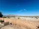 Mountain views from backyard featuring desert landscaping and a brick privacy wall at 8616 Willow Cabin St, Las Vegas, NV 89131