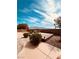Landscaped backyard with mountain views, gravel accents, and a patio area at 8616 Willow Cabin St, Las Vegas, NV 89131