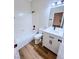 Well-lit bathroom featuring a shower-tub combo, sleek vanity, and modern fixtures at 8616 Willow Cabin St, Las Vegas, NV 89131