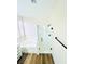 A bathroom showcases wood-look floors, a tub, and a modern glass shower at 8616 Willow Cabin St, Las Vegas, NV 89131