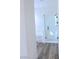 Modern bathroom featuring a glass shower, separate tub, and stylish gray flooring at 8616 Willow Cabin St, Las Vegas, NV 89131