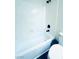 Bright bathroom featuring a white bathtub and matte black fixtures at 8616 Willow Cabin St, Las Vegas, NV 89131