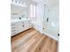 Modern bathroom featuring dual vanity, soaking tub, and glass-enclosed shower at 8616 Willow Cabin St, Las Vegas, NV 89131