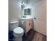 Cozy bathroom featuring modern fixtures, a toilet, vanity, and wood-look flooring for added appeal at 8616 Willow Cabin St, Las Vegas, NV 89131