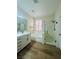 Bathroom features a soaking tub, separate shower, and updated vanity at 8616 Willow Cabin St, Las Vegas, NV 89131