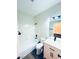 A bathroom featuring wood-look floors, a tub/shower combo, a toilet, and a vanity sink at 8616 Willow Cabin St, Las Vegas, NV 89131