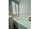 Elegant bathtub featuring a modern matte-black faucet and vanity at 8616 Willow Cabin St, Las Vegas, NV 89131