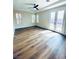 Bright bedroom featuring wood floors, French doors to the backyard, and natural light at 8616 Willow Cabin St, Las Vegas, NV 89131