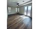 Bright bedroom with new floors, neutral walls, white trim, french doors, and modern lighting at 8616 Willow Cabin St, Las Vegas, NV 89131