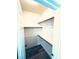 Walk-in closet with custom wood shelving and wood-look floors offers ample storage space at 8616 Willow Cabin St, Las Vegas, NV 89131