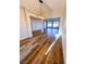 Open-concept dining room featuring a stylish chandelier, recessed lighting, and wood-look flooring at 8616 Willow Cabin St, Las Vegas, NV 89131