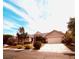 Charming single-story home with a two-car garage, desert landscaping, and mature trees in a quiet neighborhood at 8616 Willow Cabin St, Las Vegas, NV 89131
