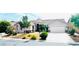 Charming single-story home featuring a well-manicured front yard and a two-car garage at 8616 Willow Cabin St, Las Vegas, NV 89131