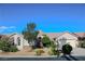 Charming single-story home featuring a well-manicured lawn and attached two-car garage at 8616 Willow Cabin St, Las Vegas, NV 89131