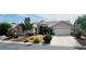 Lovely home exterior with a well-maintained yard and a two-car garage, creating a welcoming and attractive entrance at 8616 Willow Cabin St, Las Vegas, NV 89131