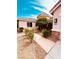 Charming front yard with desert landscaping and a well-maintained walkway leading to the front door at 8616 Willow Cabin St, Las Vegas, NV 89131