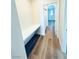 Hallway with custom built-in desk and wood flooring at 8616 Willow Cabin St, Las Vegas, NV 89131