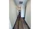 Hallway with attractive wood-look flooring extends into the home, connecting various living spaces at 8616 Willow Cabin St, Las Vegas, NV 89131