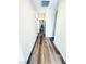 Hallway with wood flooring and neutral paint, with multiple rooms leading off it at 8616 Willow Cabin St, Las Vegas, NV 89131