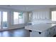 Bright eat-in kitchen featuring a large island, custom cabinets, and large sliding glass door at 8616 Willow Cabin St, Las Vegas, NV 89131