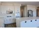 Bright kitchen features white cabinets, modern appliances, and a large center island at 8616 Willow Cabin St, Las Vegas, NV 89131