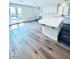 Open kitchen featuring modern white island and door to the backyard at 8616 Willow Cabin St, Las Vegas, NV 89131